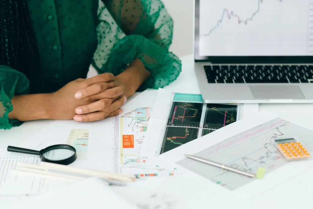 a woman viewing printed graphs