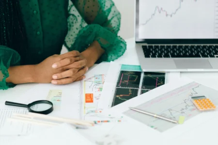 a woman viewing printed graphs