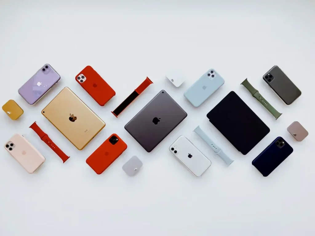 Alot of colored cell phones on table