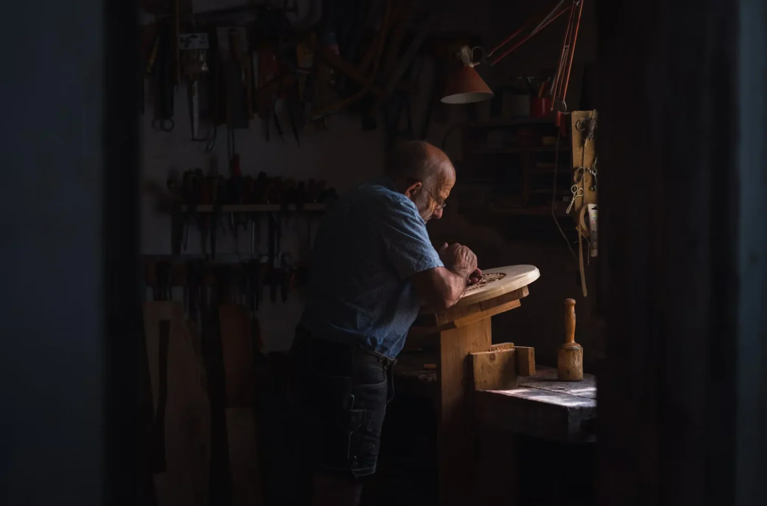 Chip Carving Knives vs. Traditional Carving Knives man working in a shop