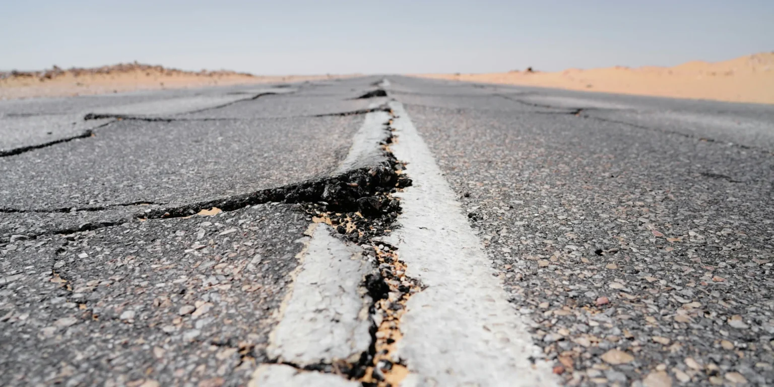 Myanmar Launches Nay Pyi Taw Reconstruction After Earthquake Damage A giant crack in a road.