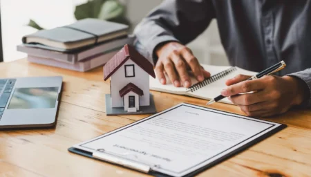 a man signing on a document