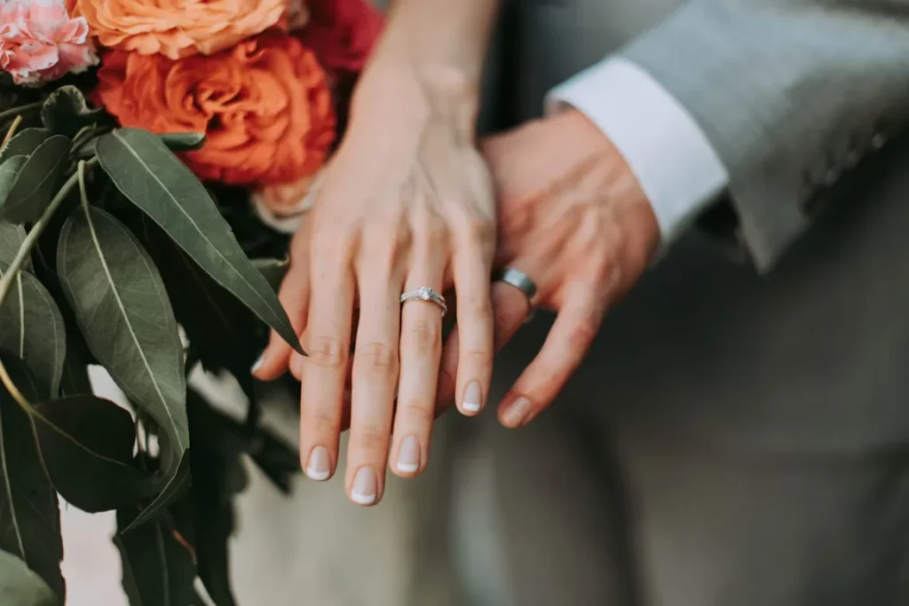 couple wearing wedding rings