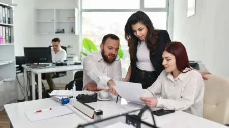 group of employess looking at a paper