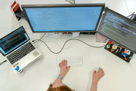 person using laptop on table