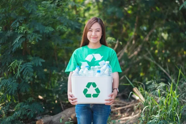 Uses for Sustainable Plastic A girl holding a bucket of bottles