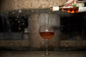 Alcohol being poured in a glass.