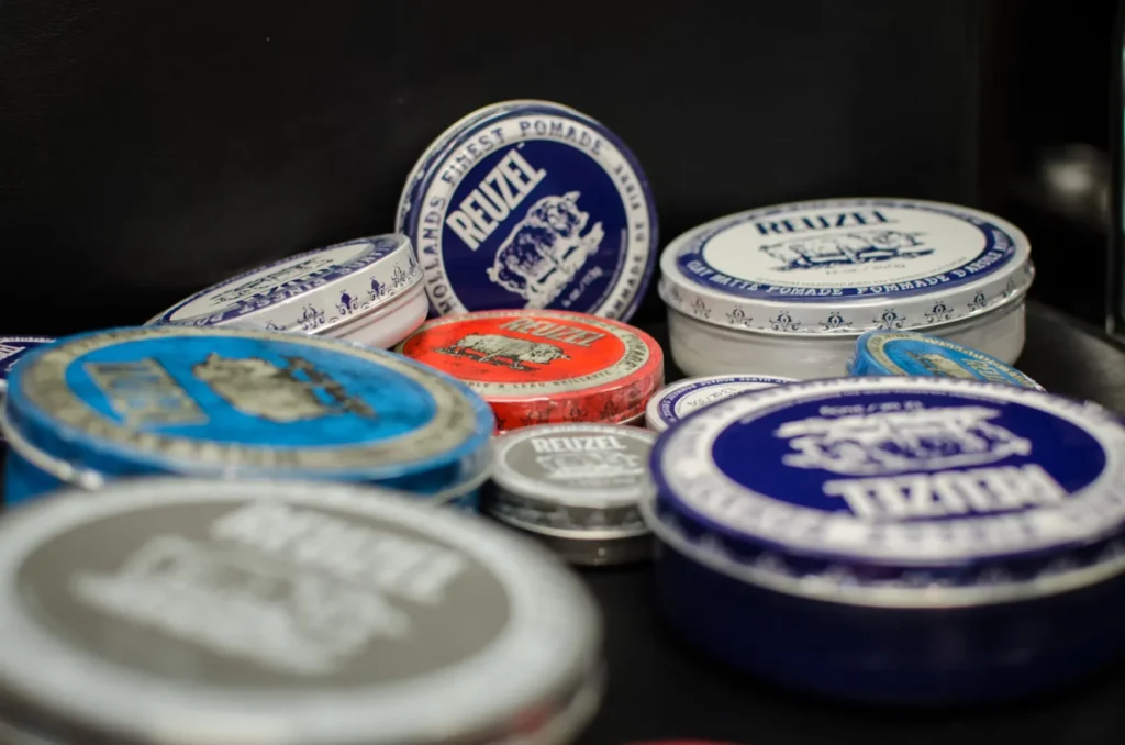 How to Apply Hair Pomades Correctly for a Perfect Look Colorful round tins