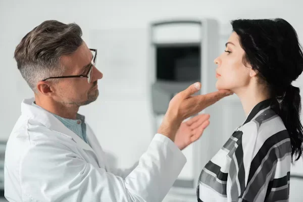 Practical Tips to Know Before Getting a Facelift Doctor examining woman's face