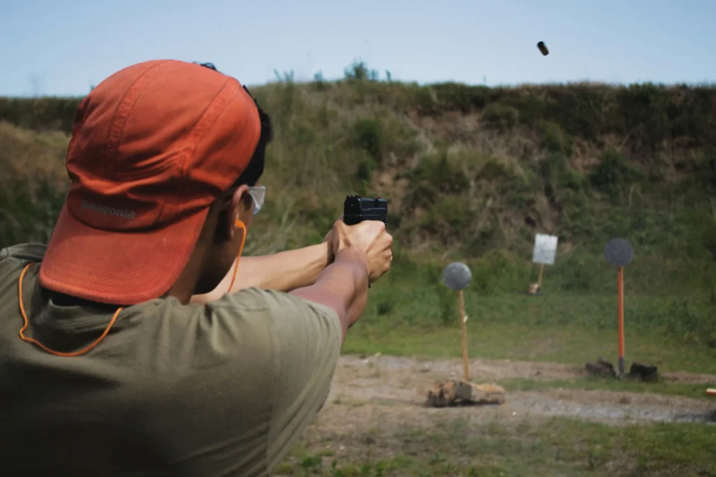 A person shooting a gun.