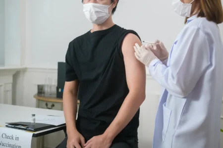 A man getting vaccinated.