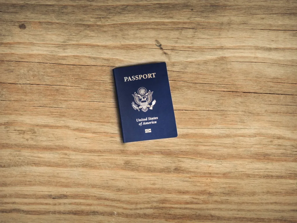 How an Immigration Lawyer Simplifies Complex Visa Applications a blue passport on desk 1