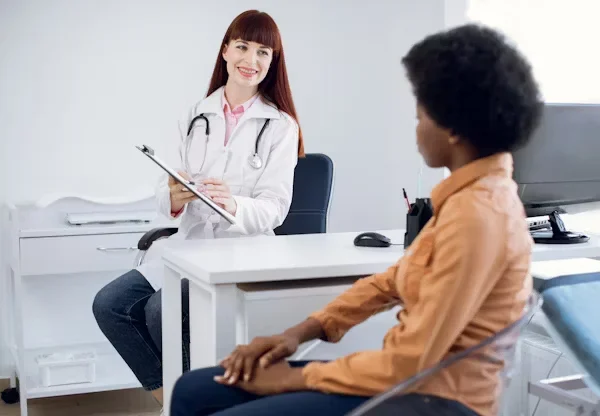 Practical Tips to Know Before Getting a Facelift Doctor smiling at her patient