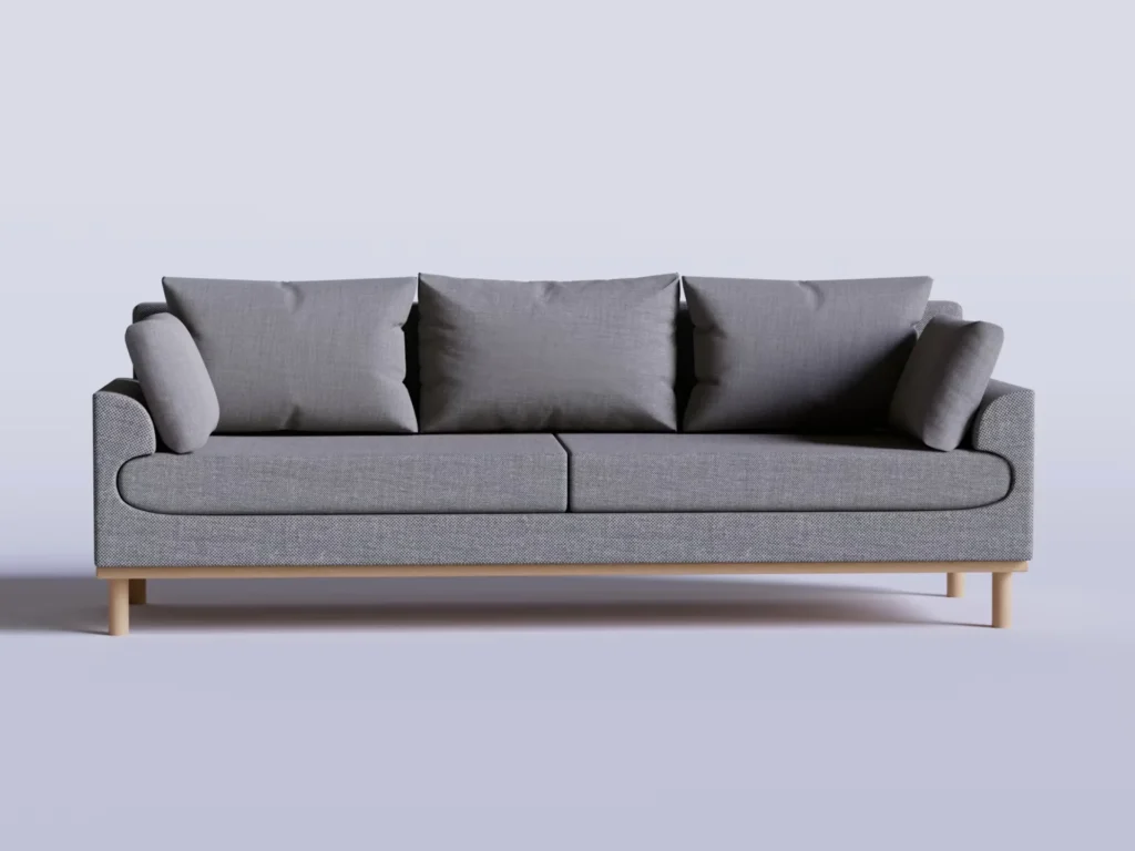 a gray couch with pillows