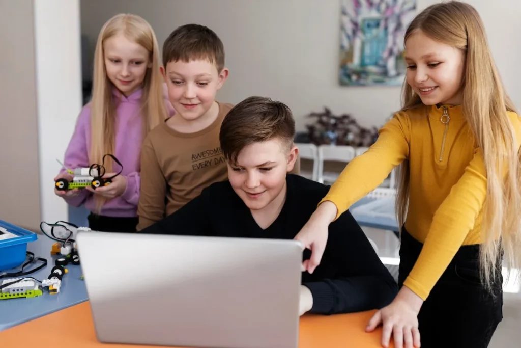 Study Smarter While Studying Abroad: Tools Every International Student Needs Group of kids watching laptop