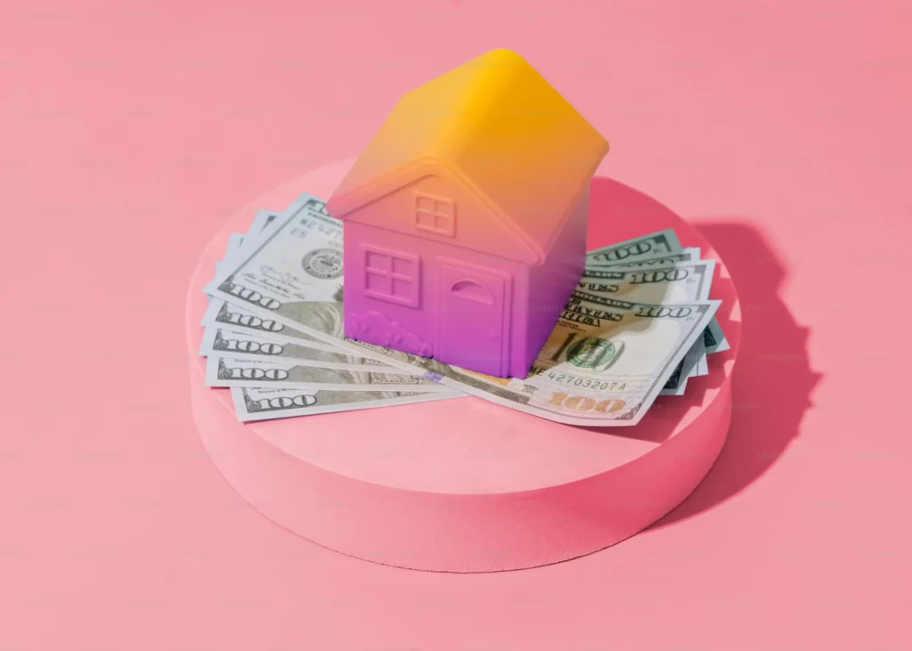 a house on pile on money