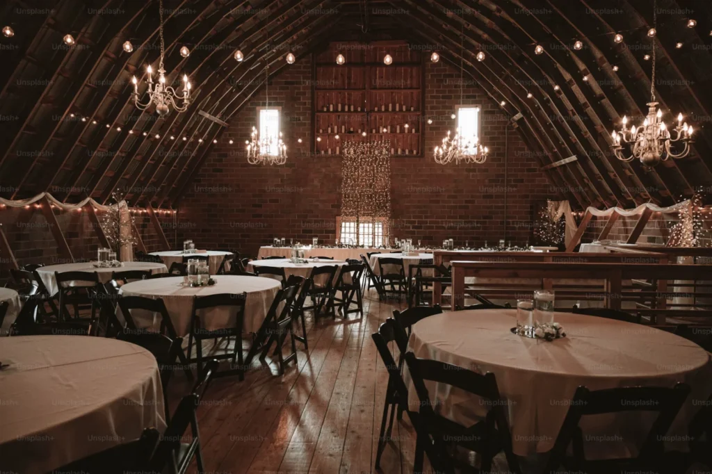 5 Simple Ways to Make Guest Arrivals More Impressive a large room with tables and chairs