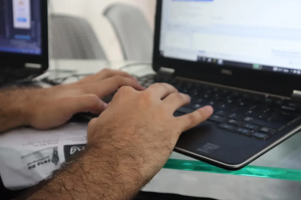 6 Essential Steps to Secure Your Spot in Postgraduate Medicine Studies in Australia a man is using laptop