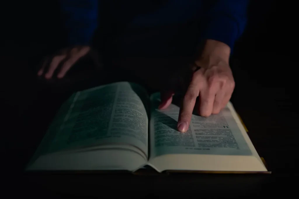 Finding Strength in Crisis: Robert Castleberry’s Stroke Survival Against All Odds a person touching a book