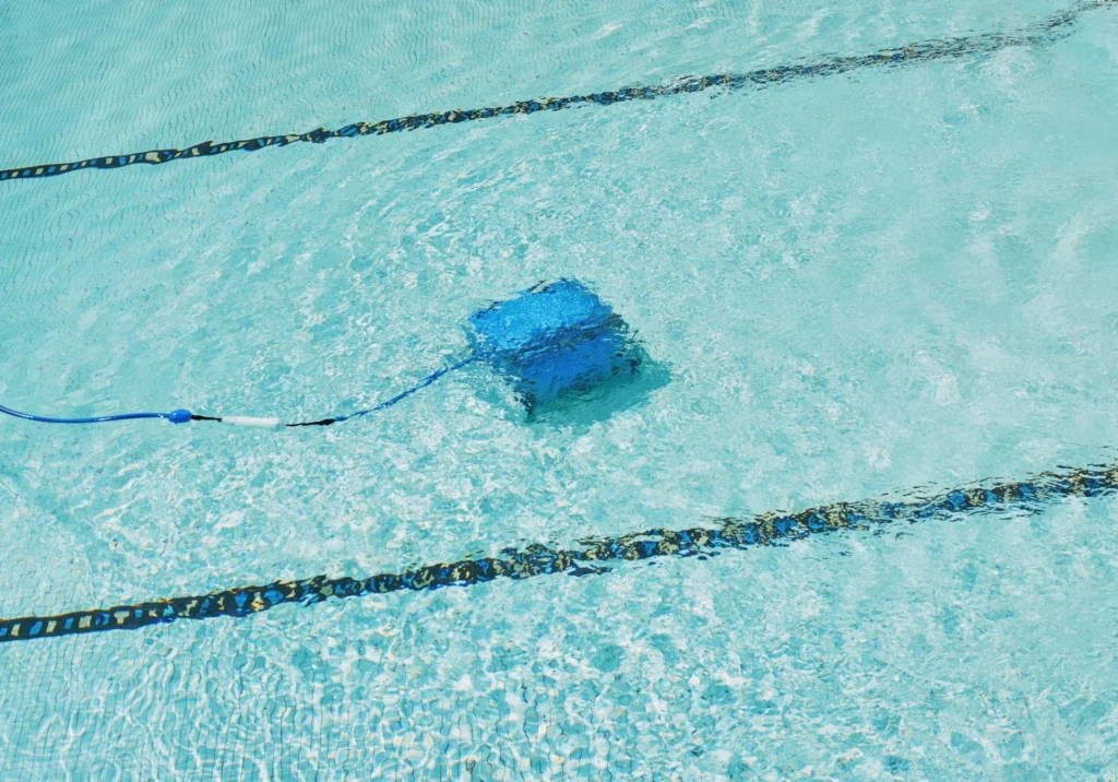 Robot Pool Cleaner Tips: How to Clean a House Pool Easily robotic pool cleaner is working underwater