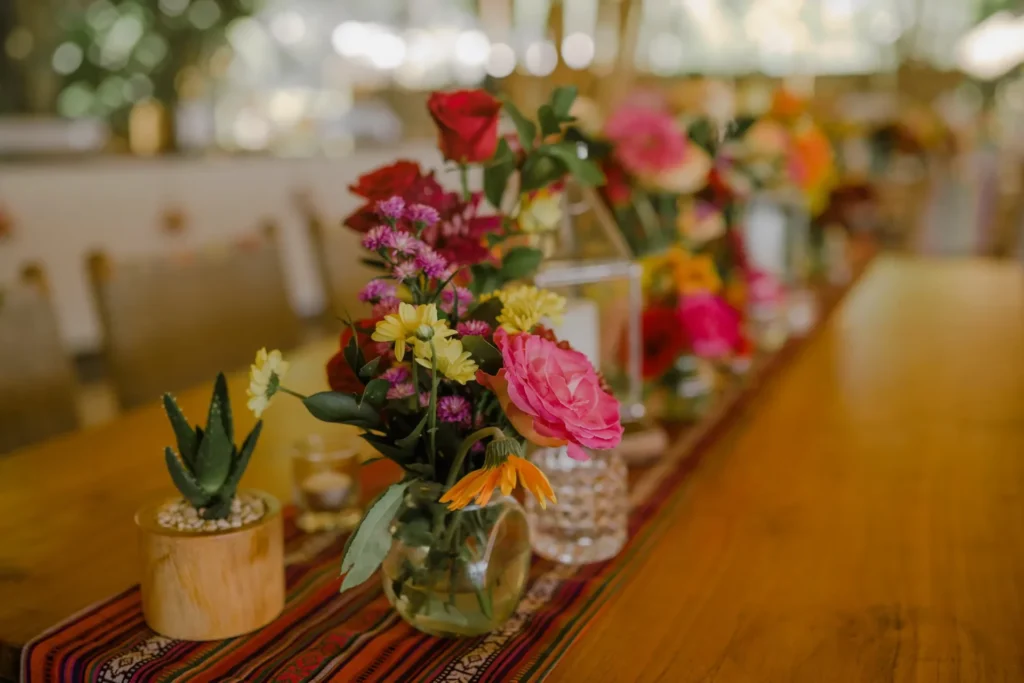 Floral Decor Inspired by the Elegance of the Emirates a table topped with vase filled with flowers