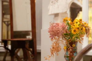 a vase of pink and yellow flowers
