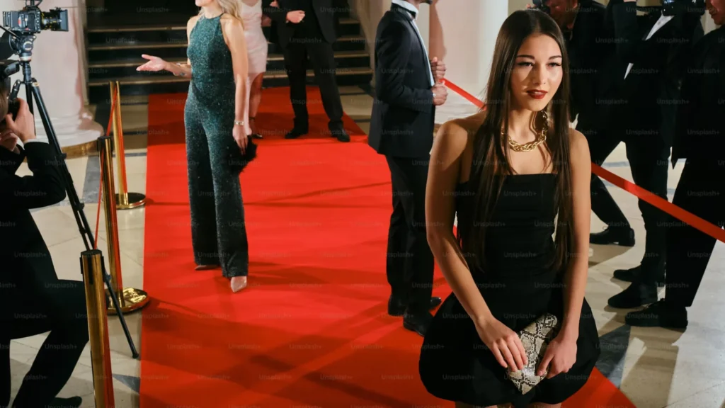 5 Simple Ways to Make Guest Arrivals More Impressive woman standing on red carpet