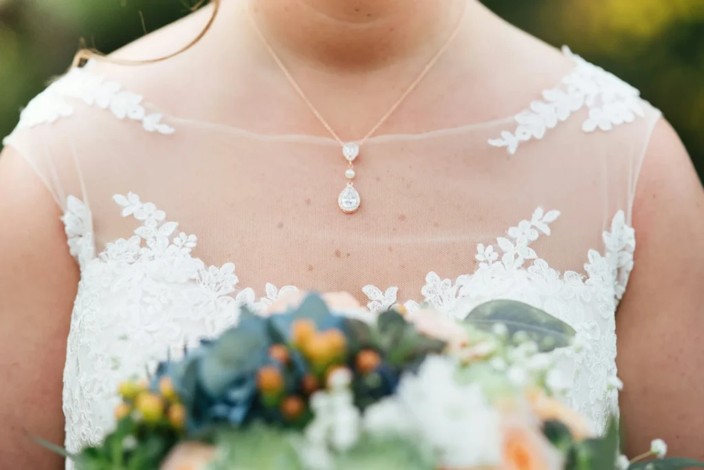 Tips for Selecting the Perfect Plus-Size Dress woman wearing wedding dress holding bouqet
