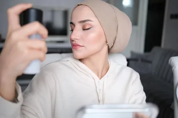 5 Best Tips for Buying the Right Liquid Foundation Woman spraying water on her face