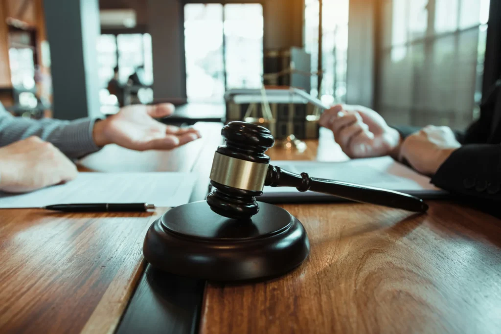 Felony vs. Misdemeanor: What's the Difference? a judge hammer on table