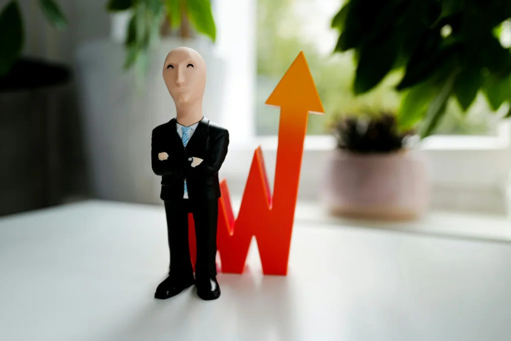 a man in black suit standing in front of arrow