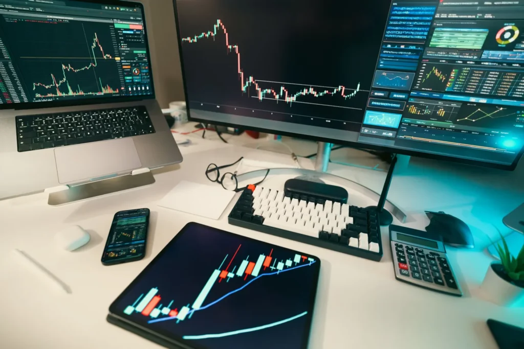 How Crypto Is Changing the Way Traders Access Prop Firm Capital graphs displayed on multiple screens