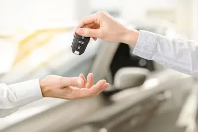 Lamborghini on Demand: Why Renting Beats Owning in Dubai’s Luxury Car Scene a man giving car keys