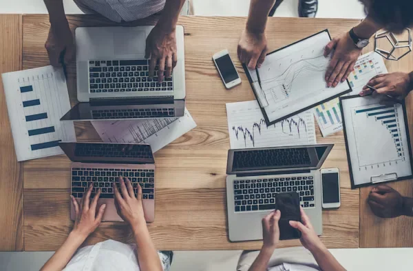 Adopting MVP Strategies for Sustainable Development A group of people using laptop
