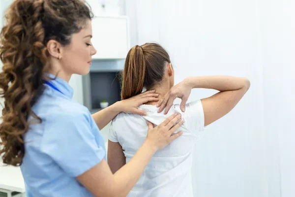 The Benefits of Getting an MSN for Women's Health Nurse Practitioner (WHNP) a physiotherapist doing healing treatment on her patient