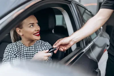 Lamborghini on Demand: Why Renting Beats Owning in Dubai’s Luxury Car Scene a person giving ca keys to a woman