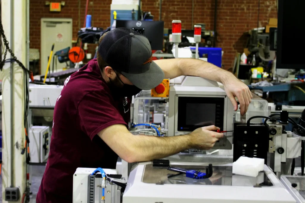 Tips for Choosing Reliable ID Card Printers for Manufacturing a man using printer