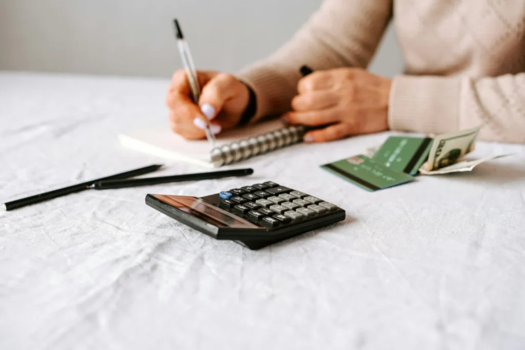 Proven Strategies to Master Business and Company Debt Negotiation person writing with pen