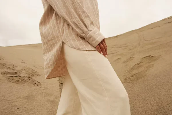 Beige Denim Clothing for a Neutral Look woman standing in sand