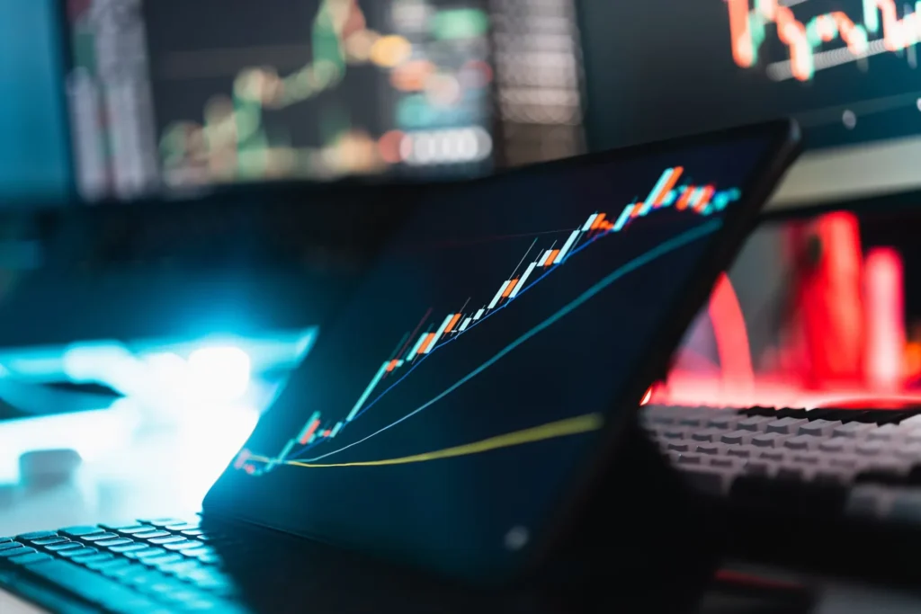How Crypto Is Changing the Way Traders Access Prop Firm Capital laptop screen showing graph