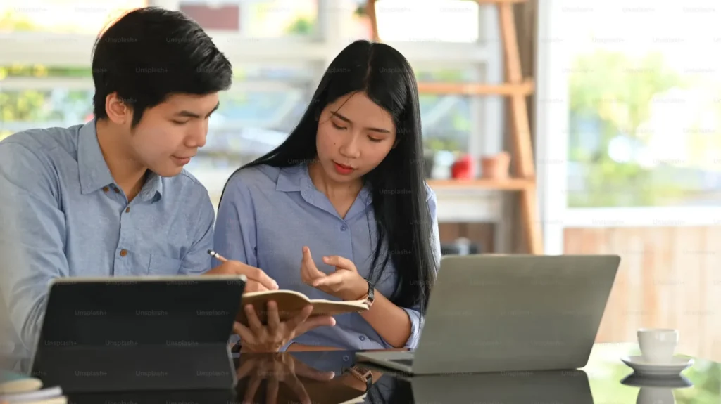 Study Smarter While Studying Abroad: Tools Every International Student Needs man and women discussing