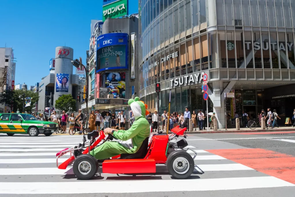 What Should You Know Before Booking a Mario Kart Experience in Tokyo? a man driving go kart