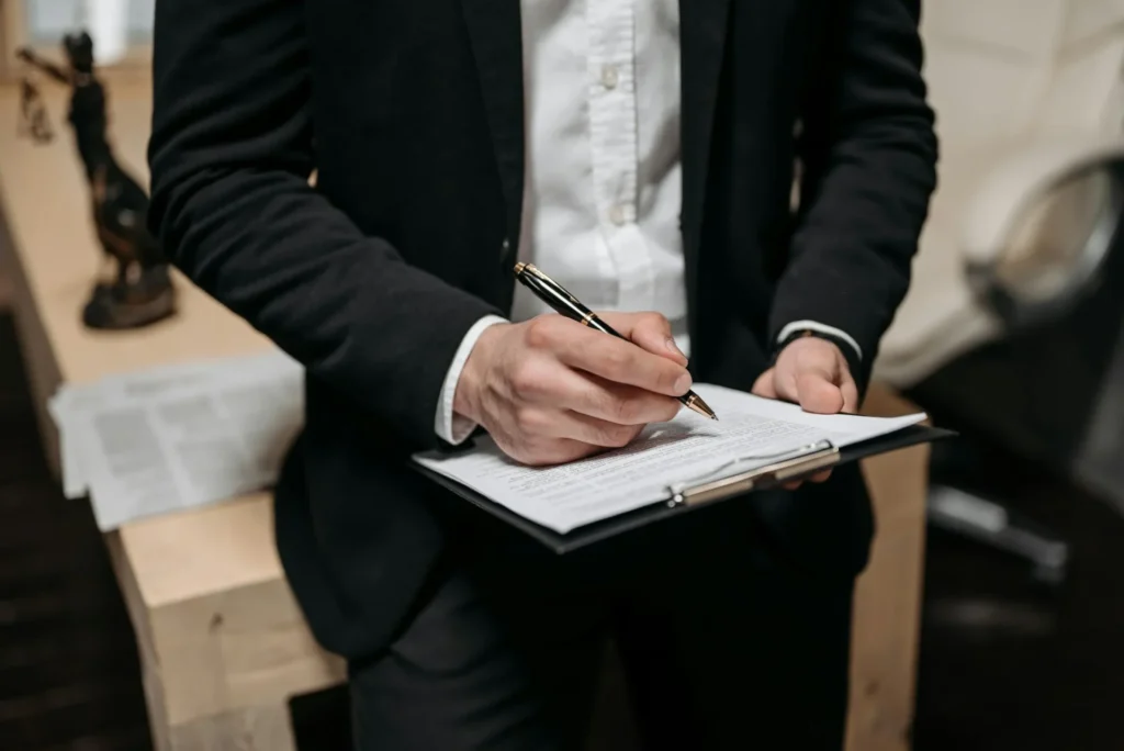 man holding board and pen in his hands