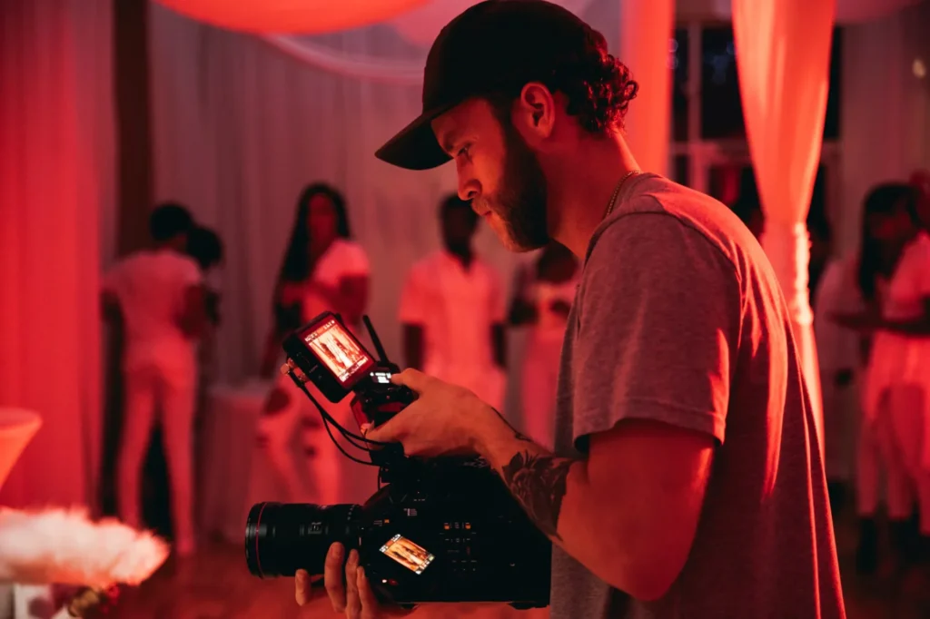 5 Simple Ways to Make Guest Arrivals More Impressive man holding camera in his hand