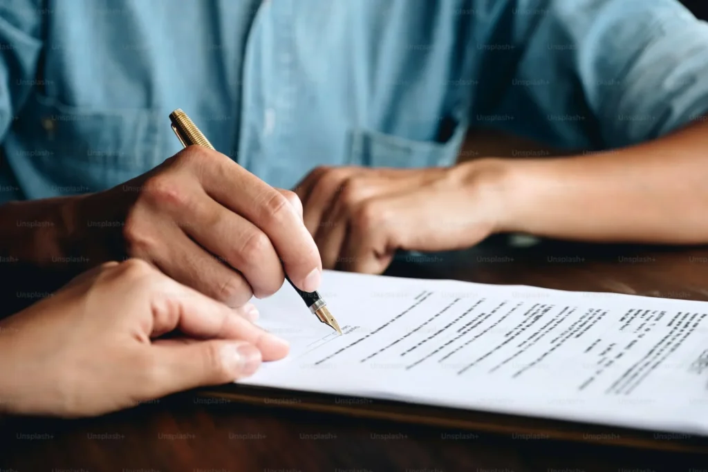 How to Spot a Low Settlement Offer After an Accident in Denver signing a contract