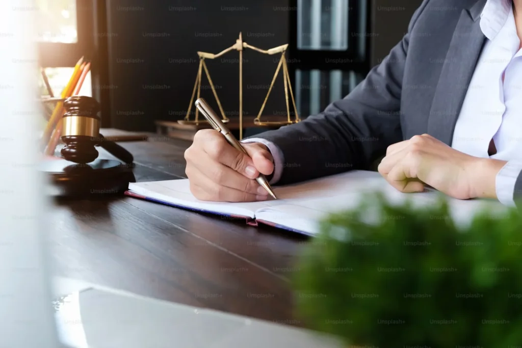 From Passion to Practice: Starting Your NP Business the Right Way a man is writing on paper