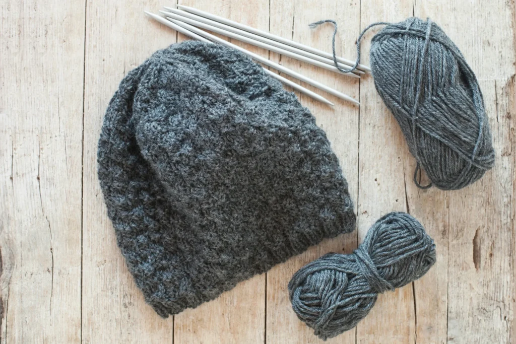 How to Change Your Game in Finding Custom Beanies grey woolen cap with pieces of wool