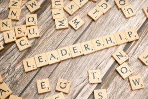 word leadership written with wooden scrabble