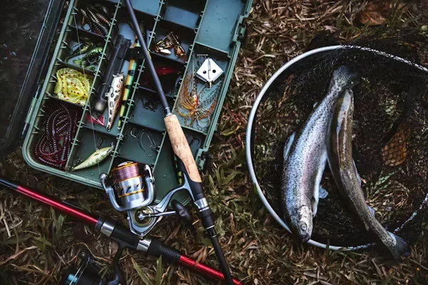 The Essential Guide to Fly Tying Vises fish and fish box on ground