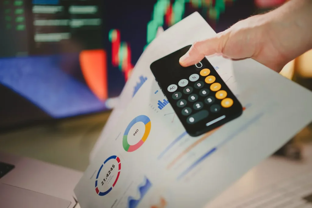 Tips on Selecting The Ideal Trade Show Exhibit Rental for Your Chicago Event a person holding a calculator and paper